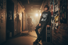 Load image into Gallery viewer, Model wearing the Jerry Lee Lewis 1972 Wembley sweatshirt backstage at a music venue