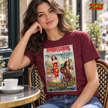 Load image into Gallery viewer, Princesse des Îles burgundy film poster T-shirt at a café with GAS logo at top right
